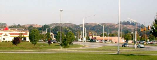 Photograph of Pine Ridge after the clearcutting occurred, as viewed from the City Center area near the Garden Plaza Hotel.