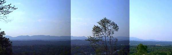 Panoramic view from a location near Pine Ridge shows the Cumberland Mountains silhouetted against the sky beyond the city of Oak Ridge.